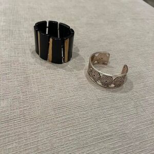 Black and gold stretch bracelet and silver tone cuff